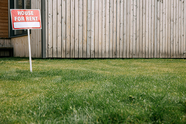 House for Rent sign in yard